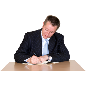 A man in a suit writing a letter at a desk