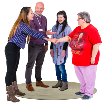 A group of people welcoming a woman to their group