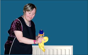 A woman holding some polish and a duster in a room with a radiator.
