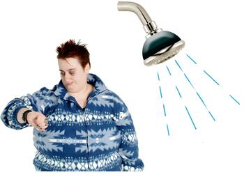 A woman looking at her watch beside a shower with water coming out of it.
