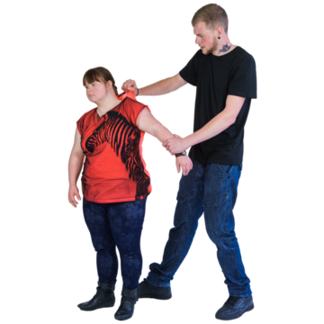 A man grabbing a teenager by the arm