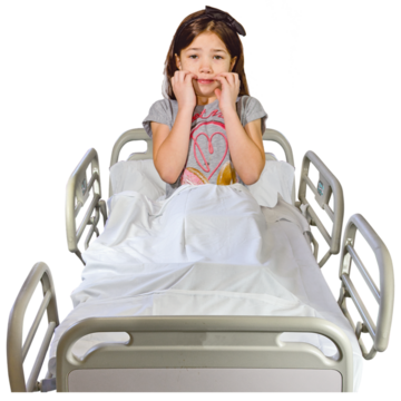 A young girl in a hospital bed sitting up looking frightened