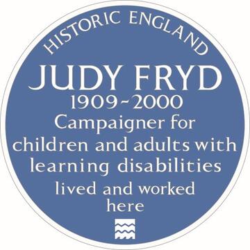 Judy Fryd's blue house plaque