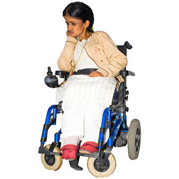 A woman sitting in a wheelchair with her chin resting on her hand.