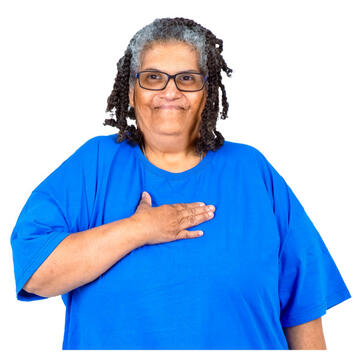 A woman smiling with her hand on her heart.