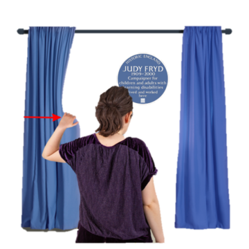 Someone pulling back a curtain to show a blue house plaque