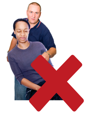 A cross beside a man reaching around to touch a woman's breast.