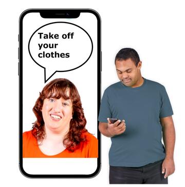 A man looking at his phone which has a picture of a lady saying 'Take off your clothes'. 