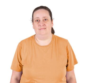 A woman with a neutral facial expression.