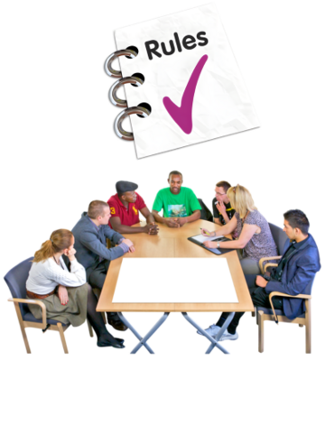 People sitting around a meeting table with a rule book above them
