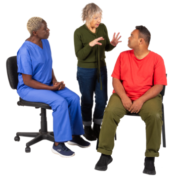 A woman explaining something to a man.  Beside them is a nurse.
