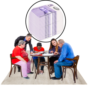 A group of people sitting around a table.  Behind them is a pile of money in a circle.