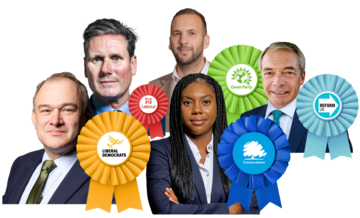 A group of MPs with their rosettes to show which party they represent.
