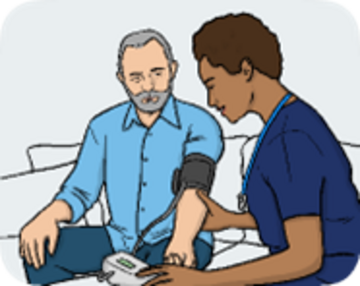 A man sitting having his blood pressure taken by a doctor or nurse.