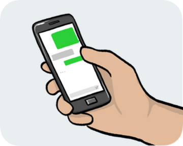 A hand holding a mobile phone which has a message on the screen.
