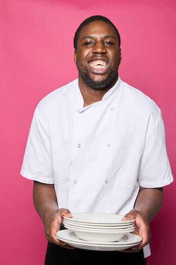 Aaron holding some plates