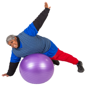 A woman leaning on a fitness ball with one hand on the ground and the other hand in the air.