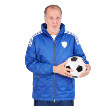 A man in a sports coat holding a football.