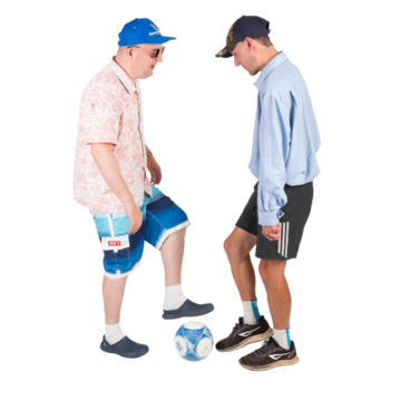 Two men in shorts with a football.