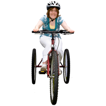 A woman riding a tricycle.
