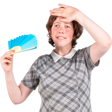 A woman using a hand held fan to keep cool in hot weather
