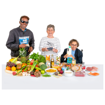 3 people behind a table of healthy food