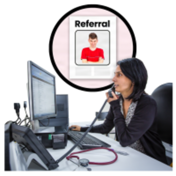 A doctor on the phone and looking at her computer.  Behind her is a piece of paper with a picture of a person and the word referral on it.