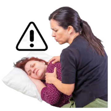 A woman is trying to wake someone up