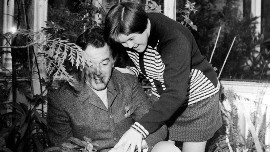 Black and white photo of a father with his daughter.