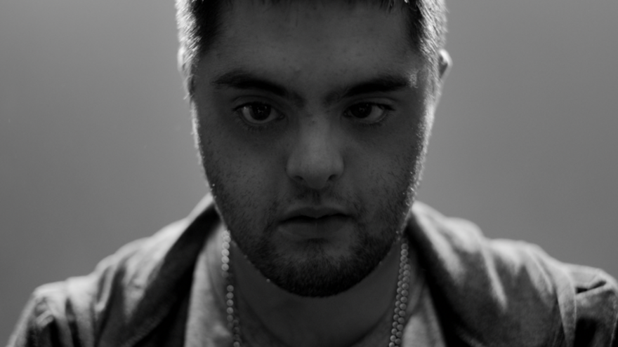Young man looking into camera