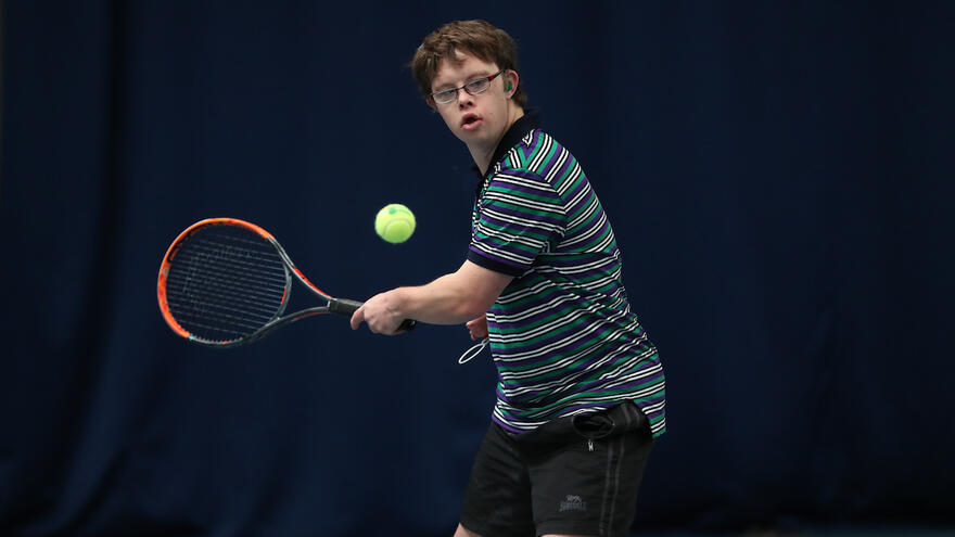 Young man playing tennis