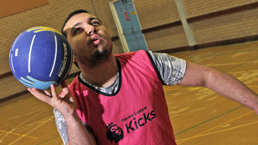 A man throwing a basketball