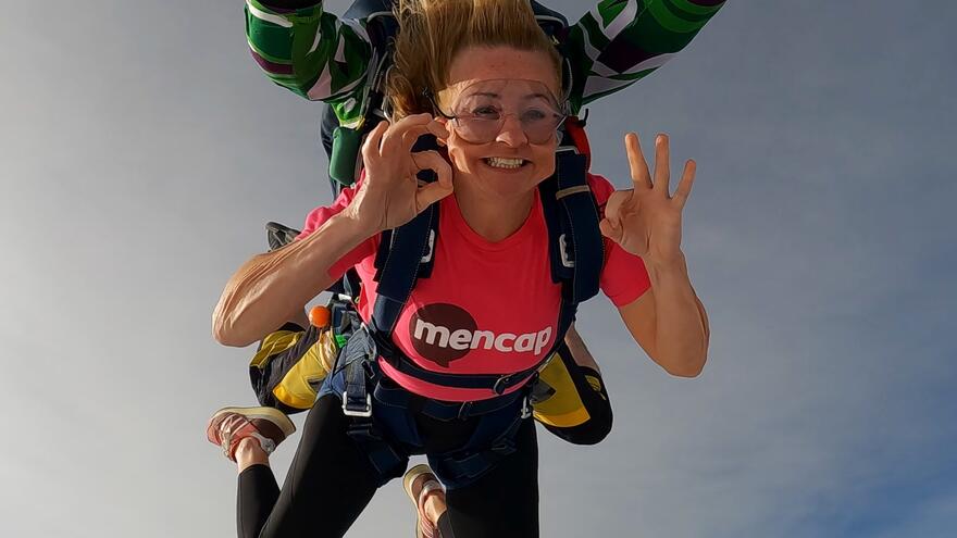 Two people tandem skydiving