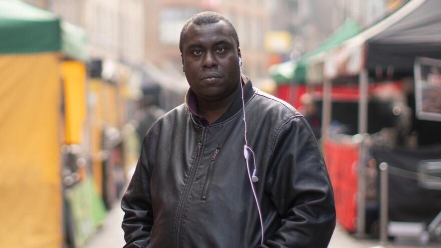 Richard walking through a street market