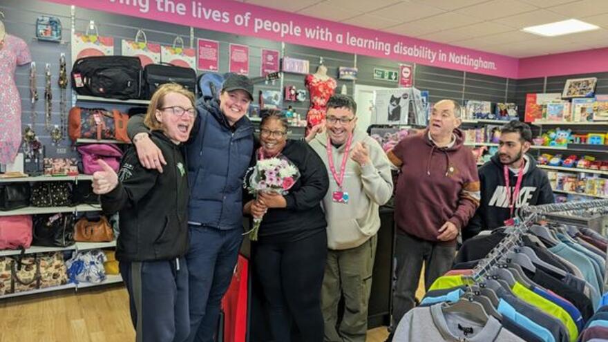A group of people in a charity shop
