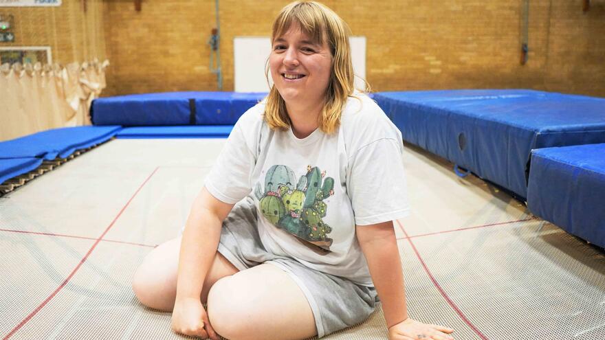 Person sitting on a trampoline 