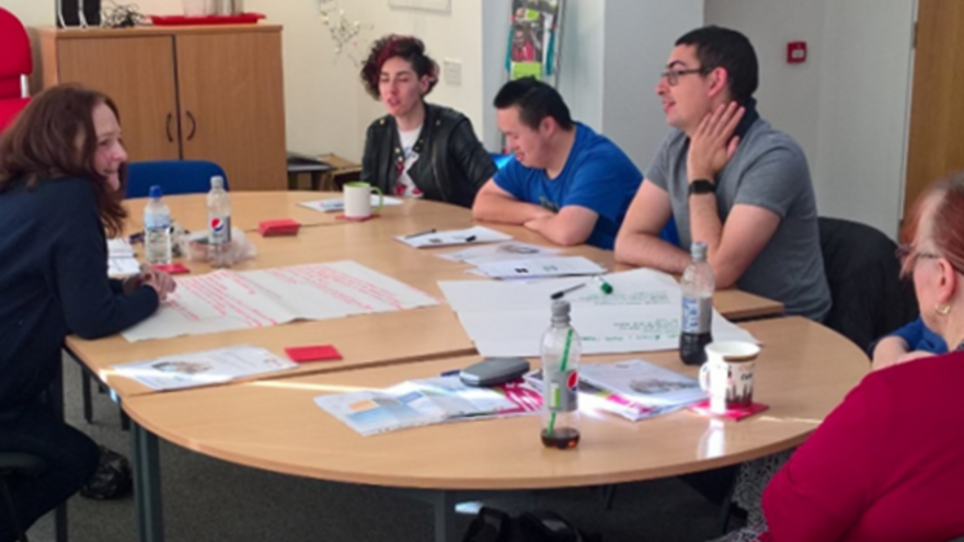 Mencap colleagues sitting around a table 