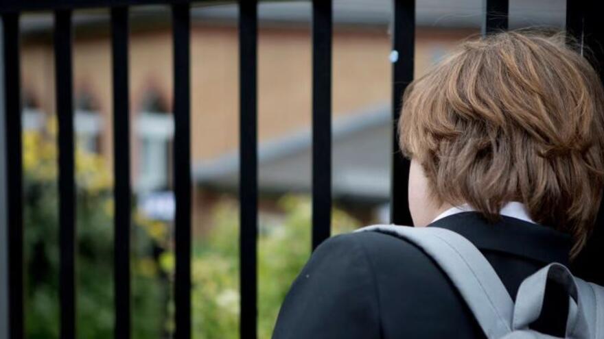 A school child at the school gates