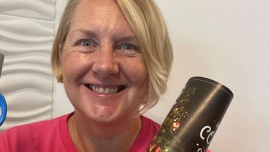 Karen Anderson smiling at the camera with Mencap top