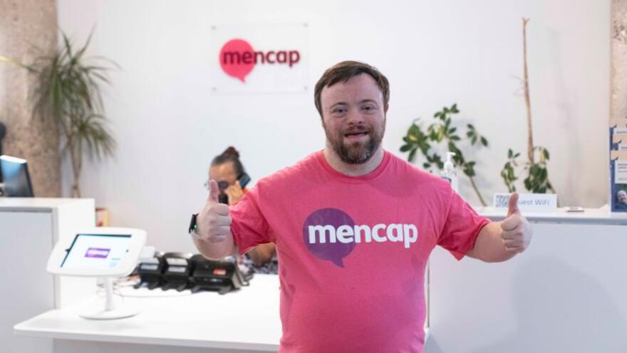 James Martin in a Mencap T-shirt with his thumbs up