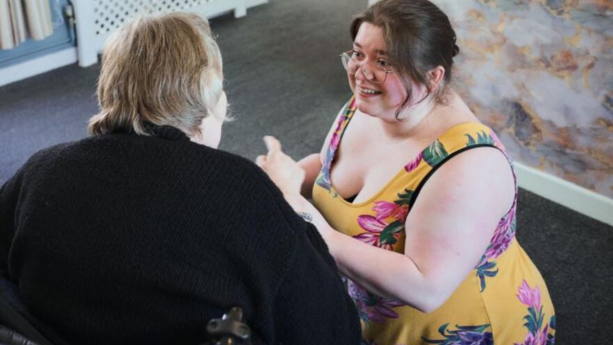 A support worker with a resident at Trelawney House Plymouth