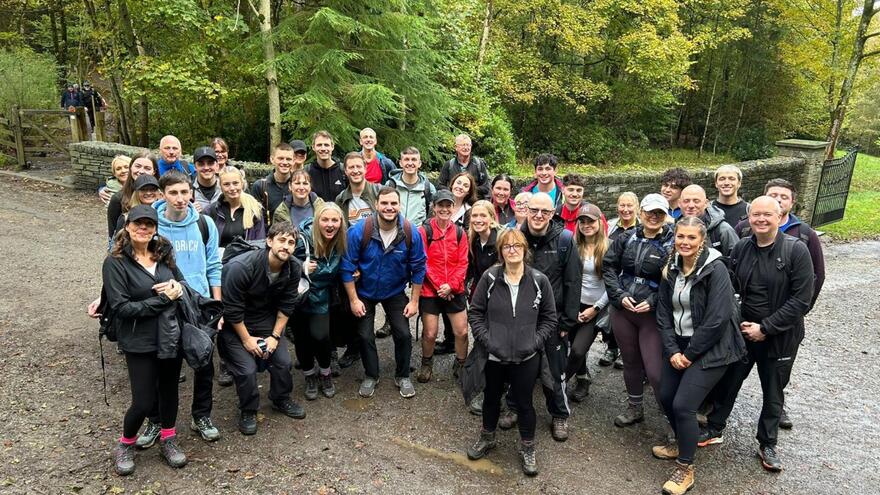 Big group of Aviva staff supporting Mencap in hiking gear