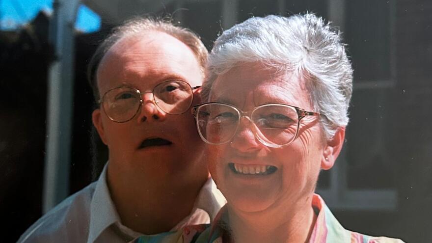 Rosemary and Robert smiling at the camera outside