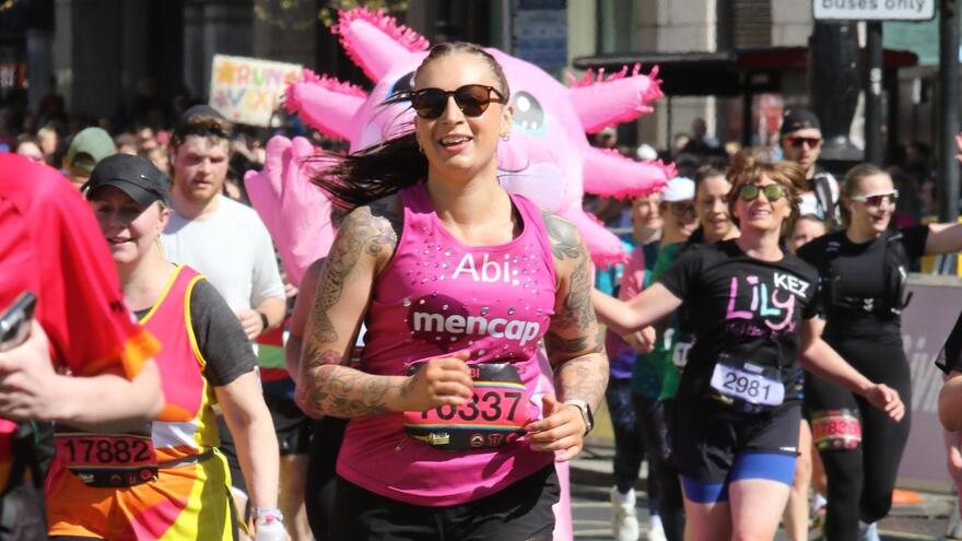 Abi Humble running with Mencap pink vest