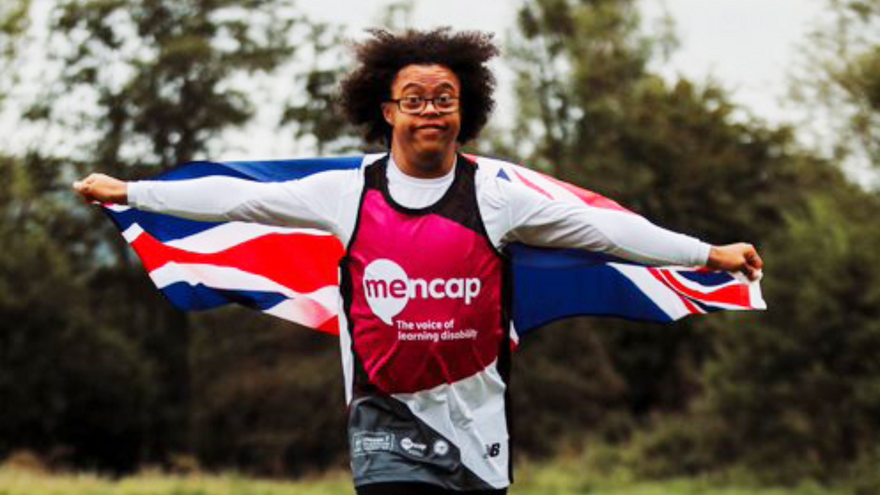 Michael running with the Union Jack Flag.