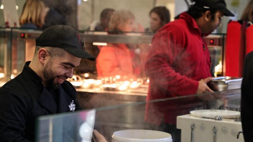 People working in a Chopstix restaurant