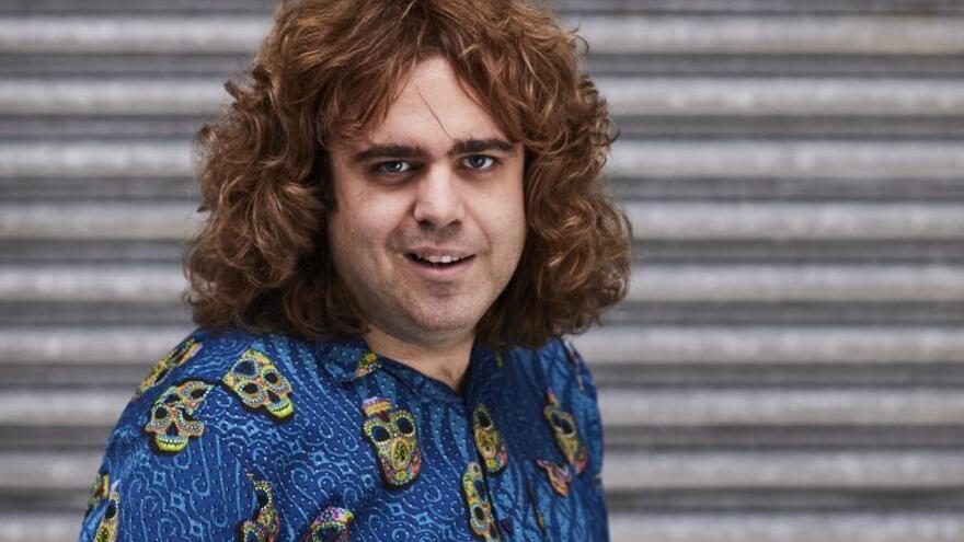 Daniel Wakeford Mythbuster standing in front of a roller shutter