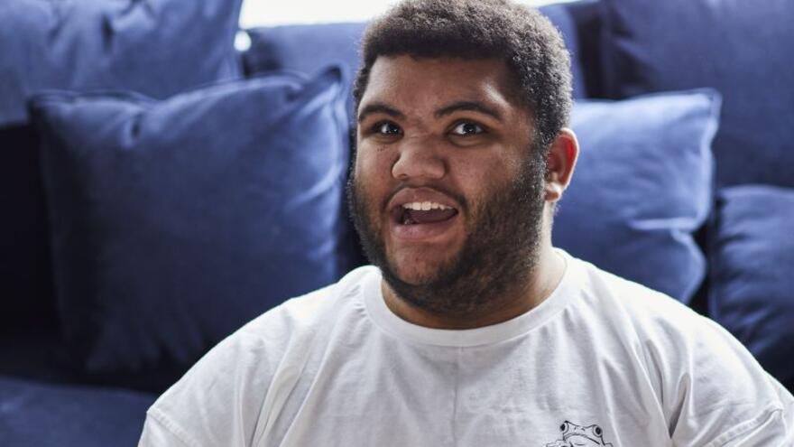Mythbuster Harvey Price sitting on a sofa