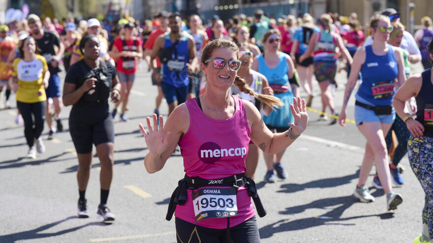 London landmarks runner smiles at the camera