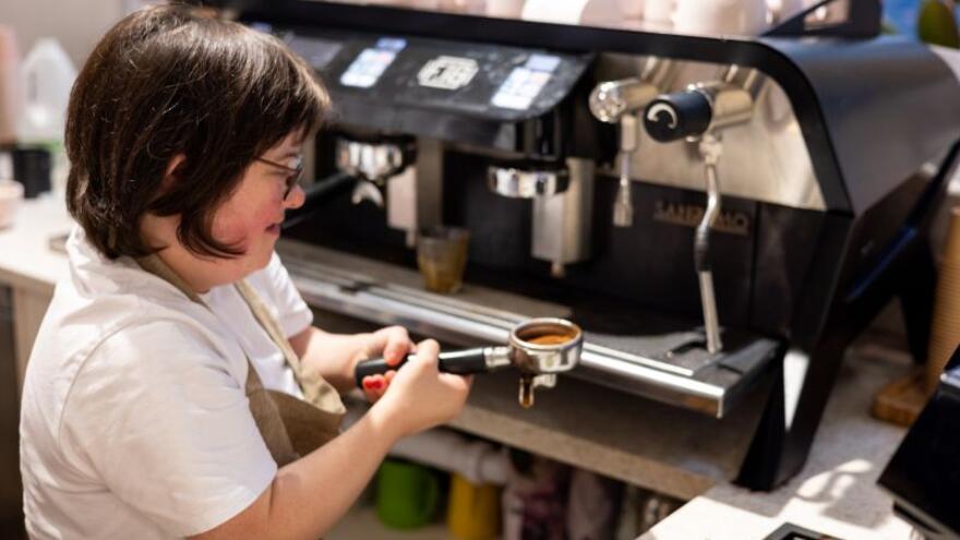 Ella working in a coffee shop